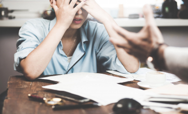 Boss threatening with finger his employee, isolated